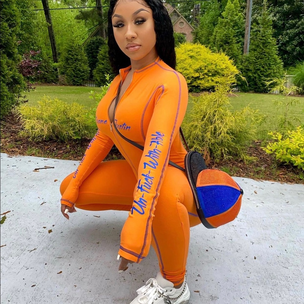 Orange Shane Justin ‘Unfuckwithable’ Bodysuit. NWT never worn! Perfect condition